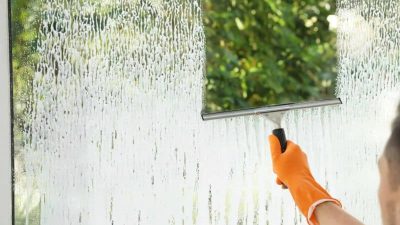 handyman washing window